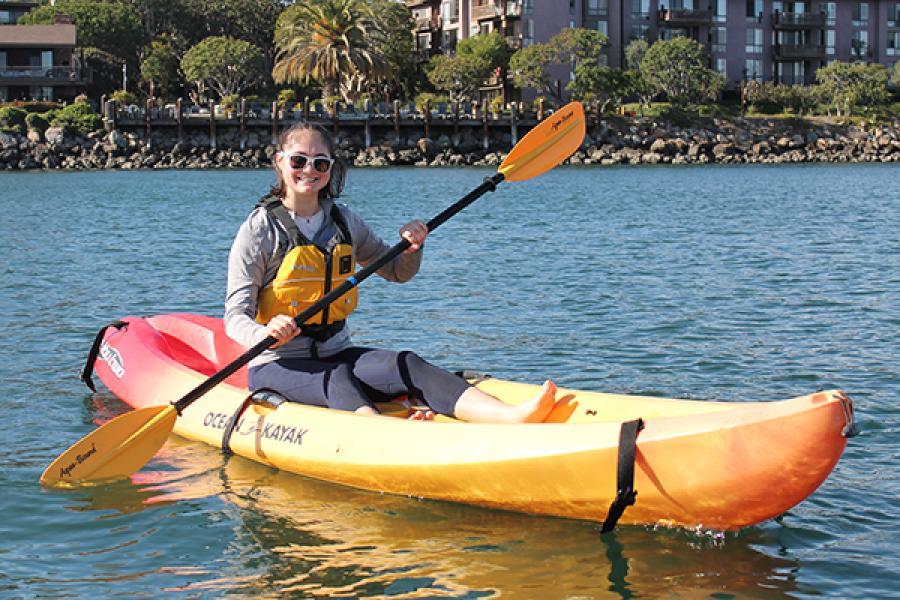 woman in sit down kayak