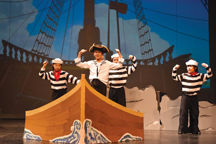 children dressed as pirates in a play performance